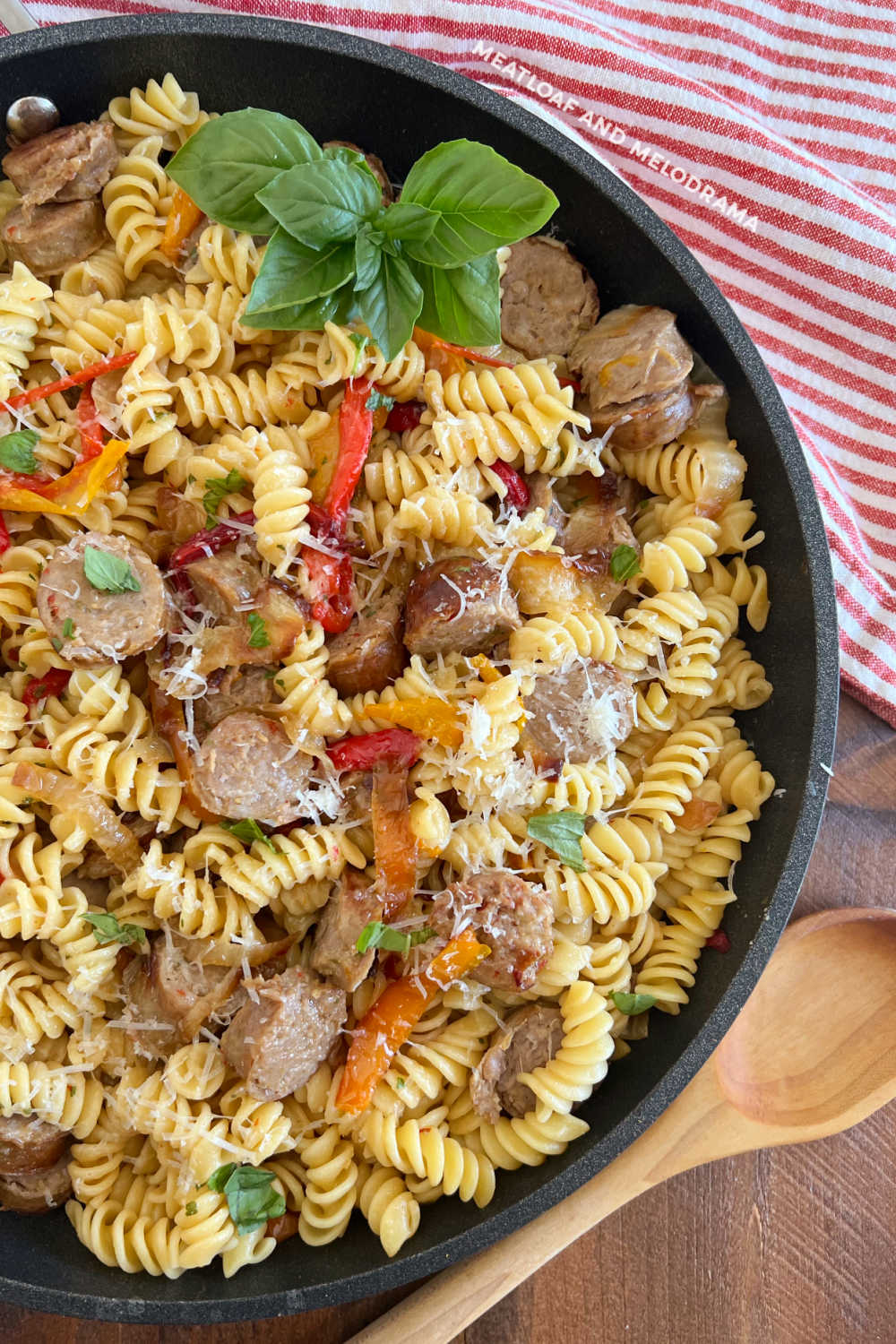 leftover italian sausage and peppers pasta with basil in skillet