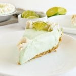 slice of no bake key lime pie with graham cracker crust on a plate