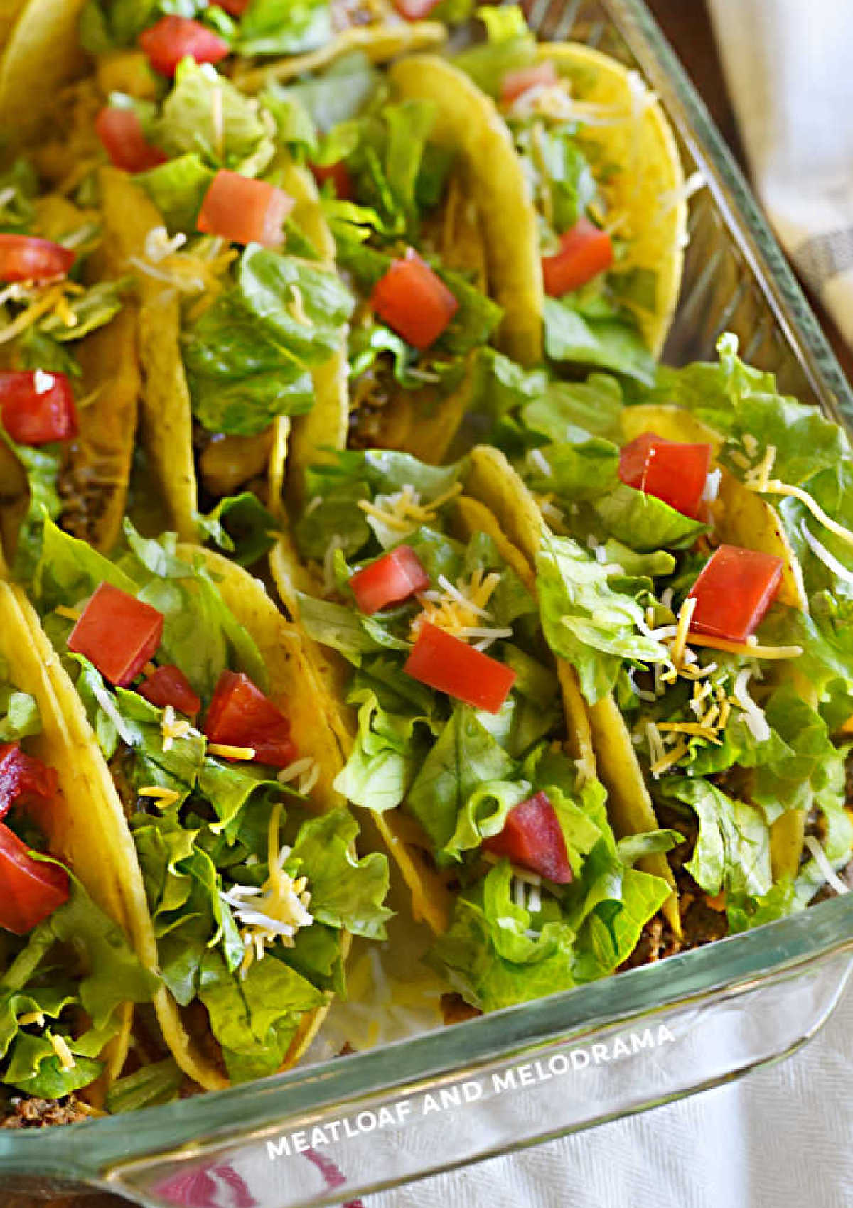 crispy ground beef baked tacos in baking dish