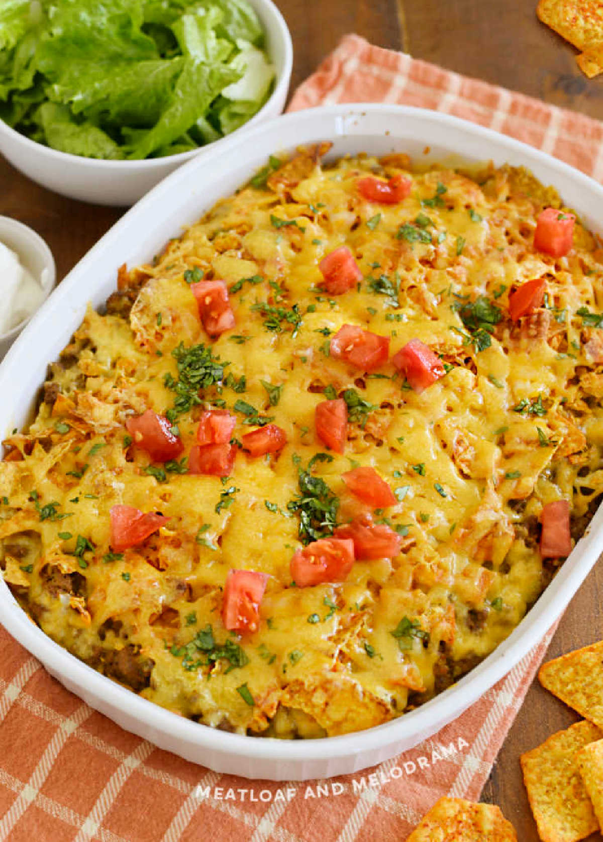 doritos casserole with ground beef, cheese, tomatoes and cilantro