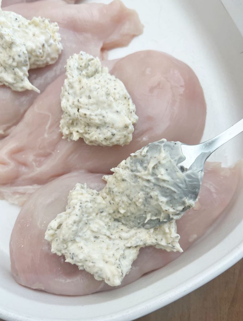 spread mayo mixture over chicken breast in baking dish