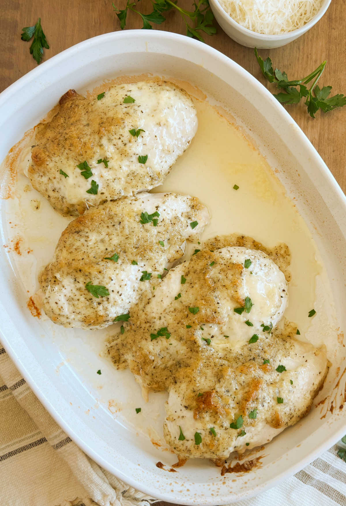oven baked parmesan crusted chicken breasts in baking dish