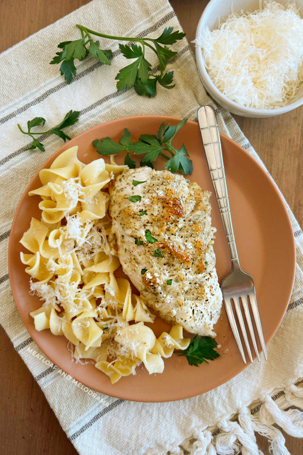 plate of mayo parmesan chicken without breadcrumbs with egg noodles