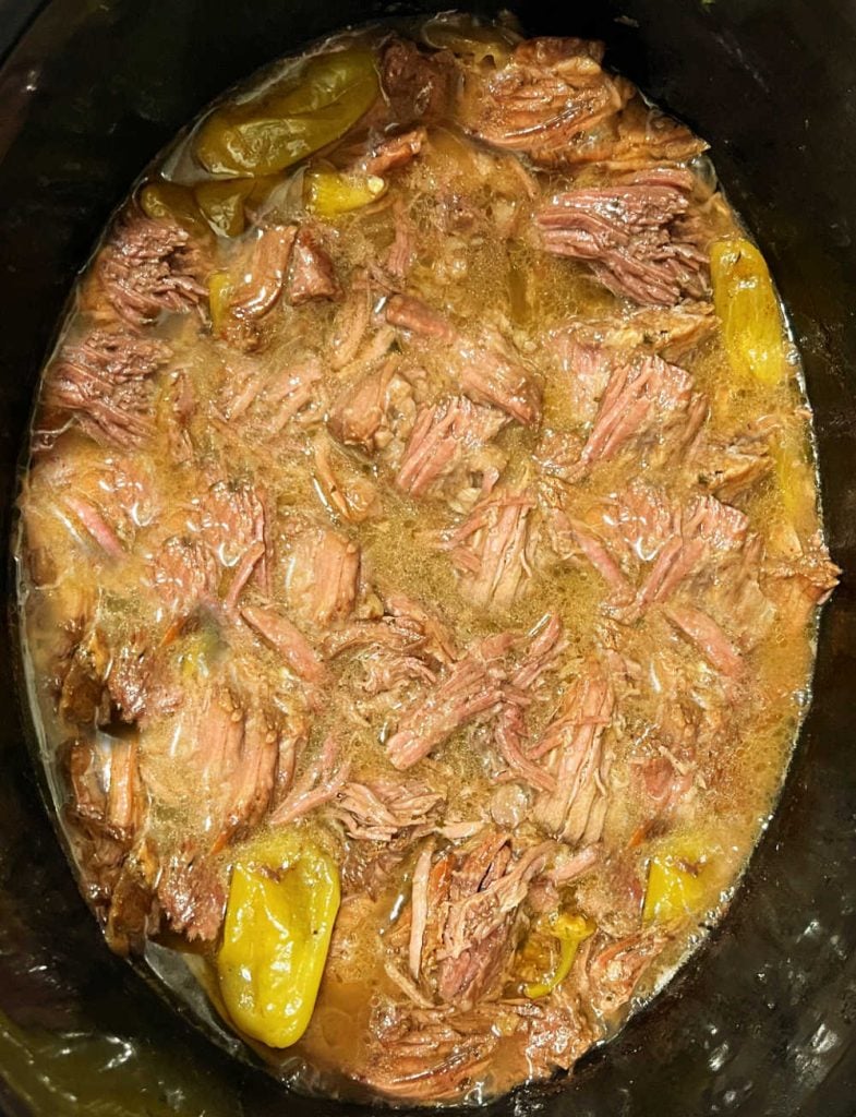 shredded Mississippi roast and gravy in slow cooker