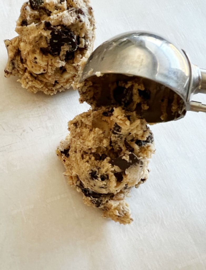 use cookie scoop to place dough on cookie sheet