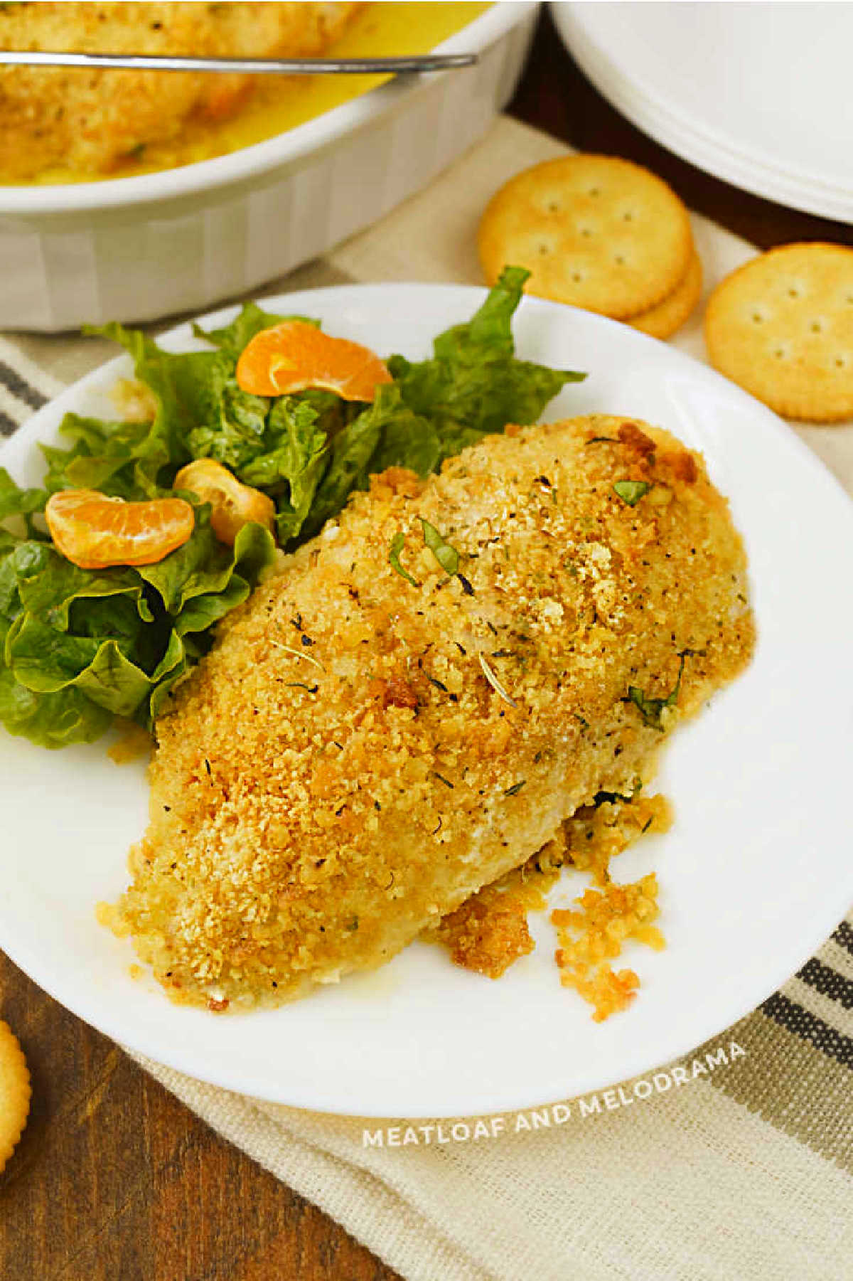 ritz cracker chicken coated with cracker crumbs on a plate