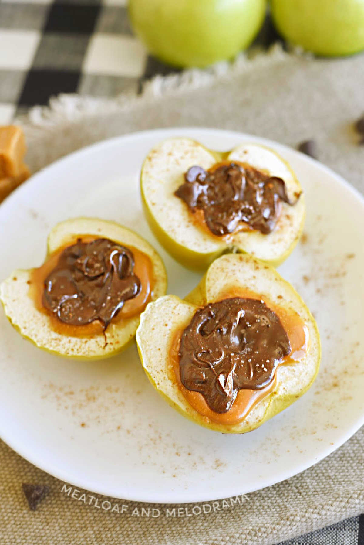 baked apples with caramel in the middle and melted chocolate