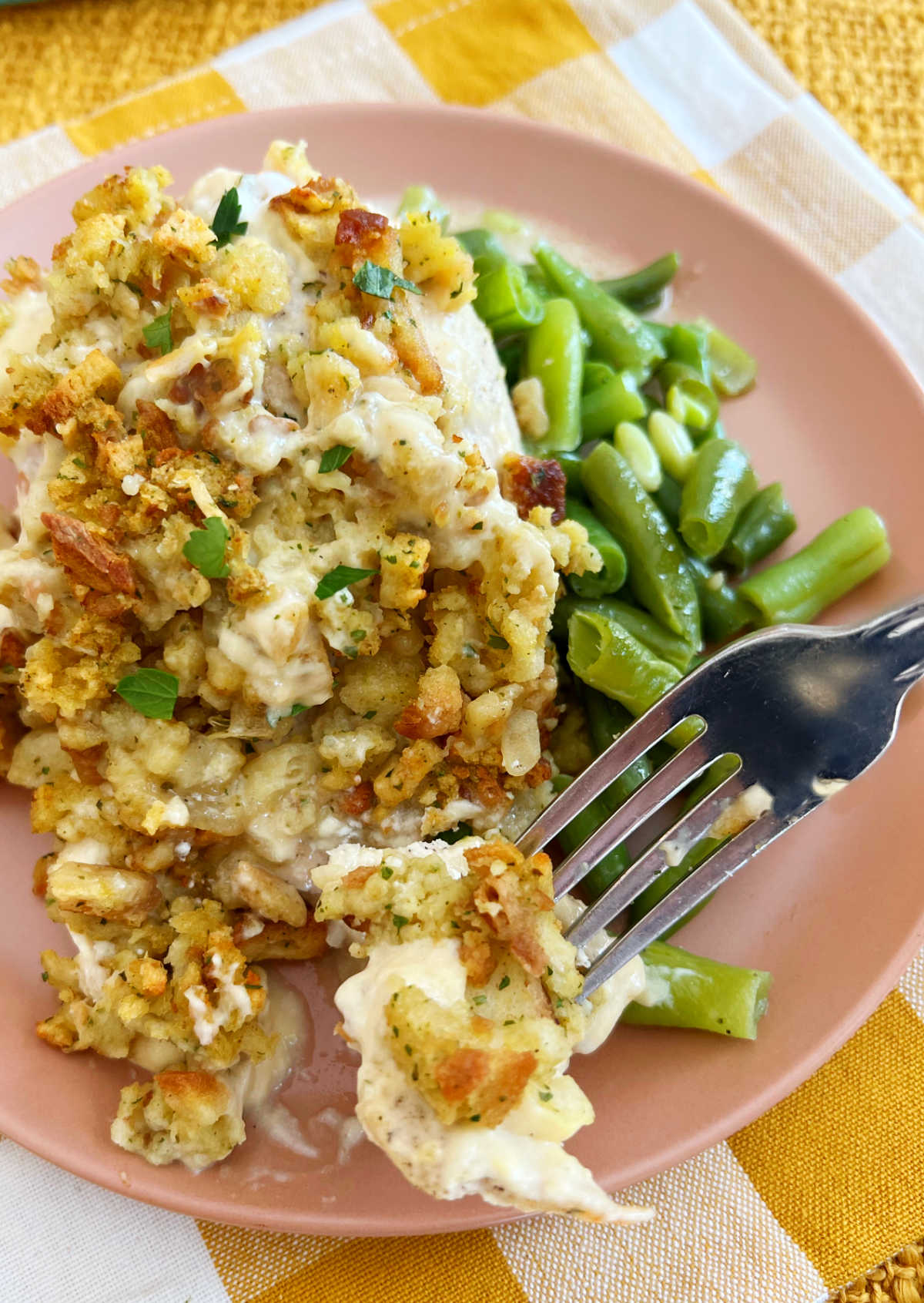 chicken stuffing bake with green beans on fork