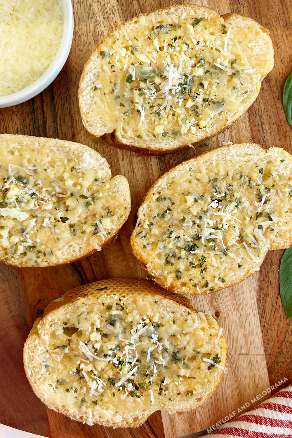homemade garlic bread slices with Parmesan cheese and parsley