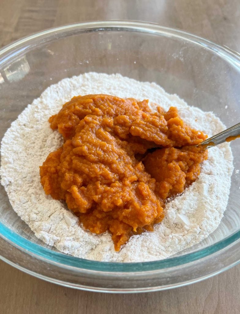 cake mix and pumpkin puree in mixing bowl