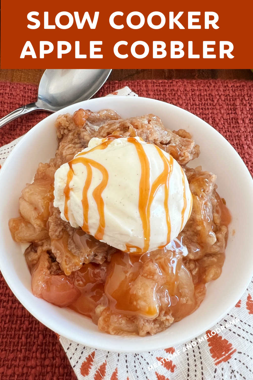 This Slow Cooker Apple Cobbler Recipe with apple pie filling and spice cake mix is a delicious dessert for fall. The easiest apple cobbler ever and a family favorite! via @meamel