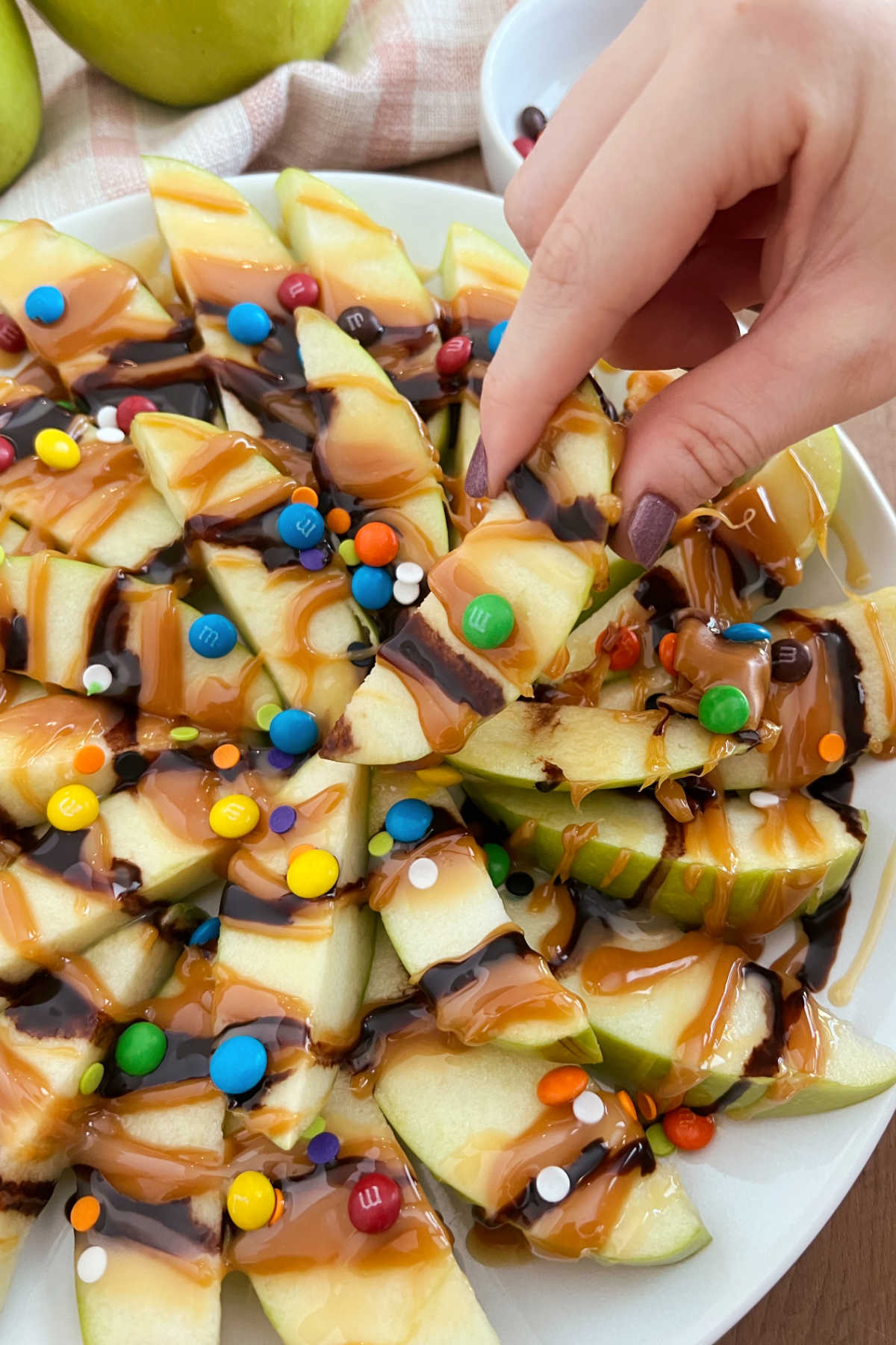 caramel apple nachos in hand