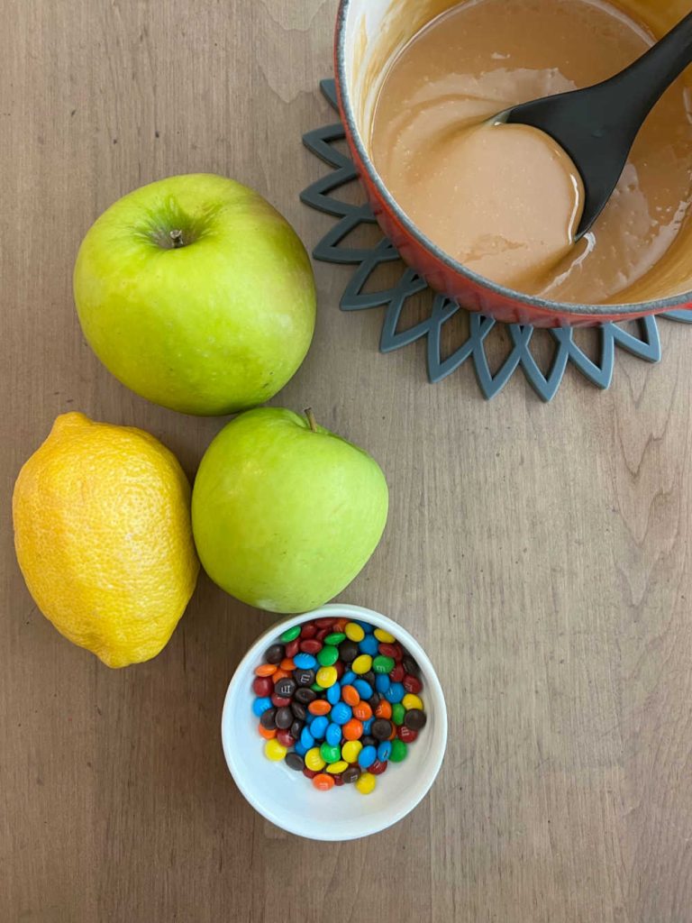 granny smith apples, lemon, caramel sauce and mini m and m's candy