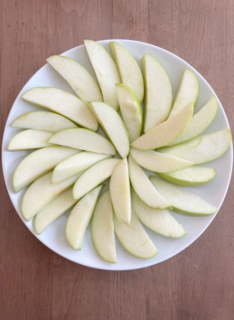 apple slices on a white platter