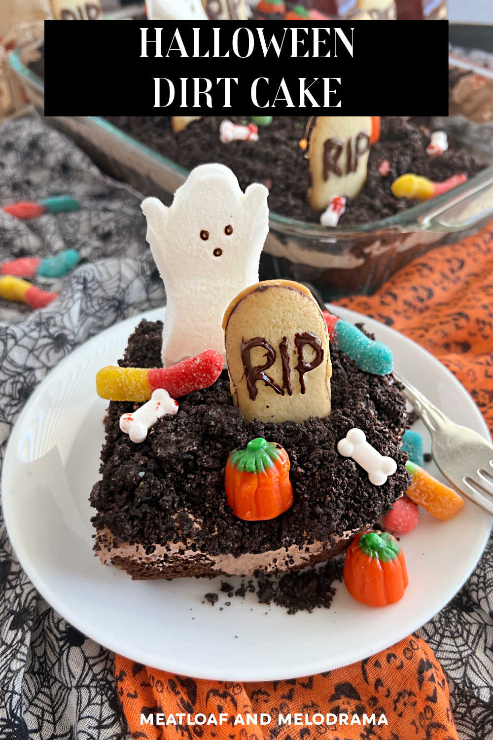 Halloween Dirt Cake Recipe (Graveyard Cake) with cake mix, chocolate pudding, crushed Oreos, gummy worms and candy is a fun Halloween dessert. This easy recipe is perfect for a Halloween party and so much fun to make! via @meamel