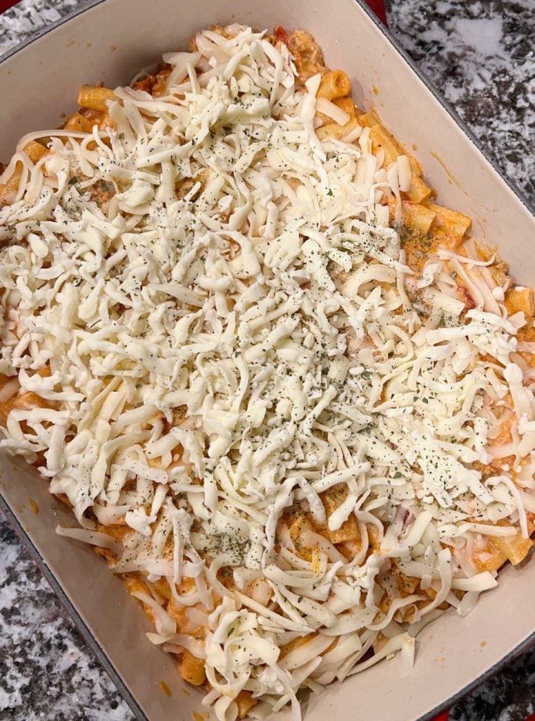 layer ziti in casserole dish with mozzarella cheese on top