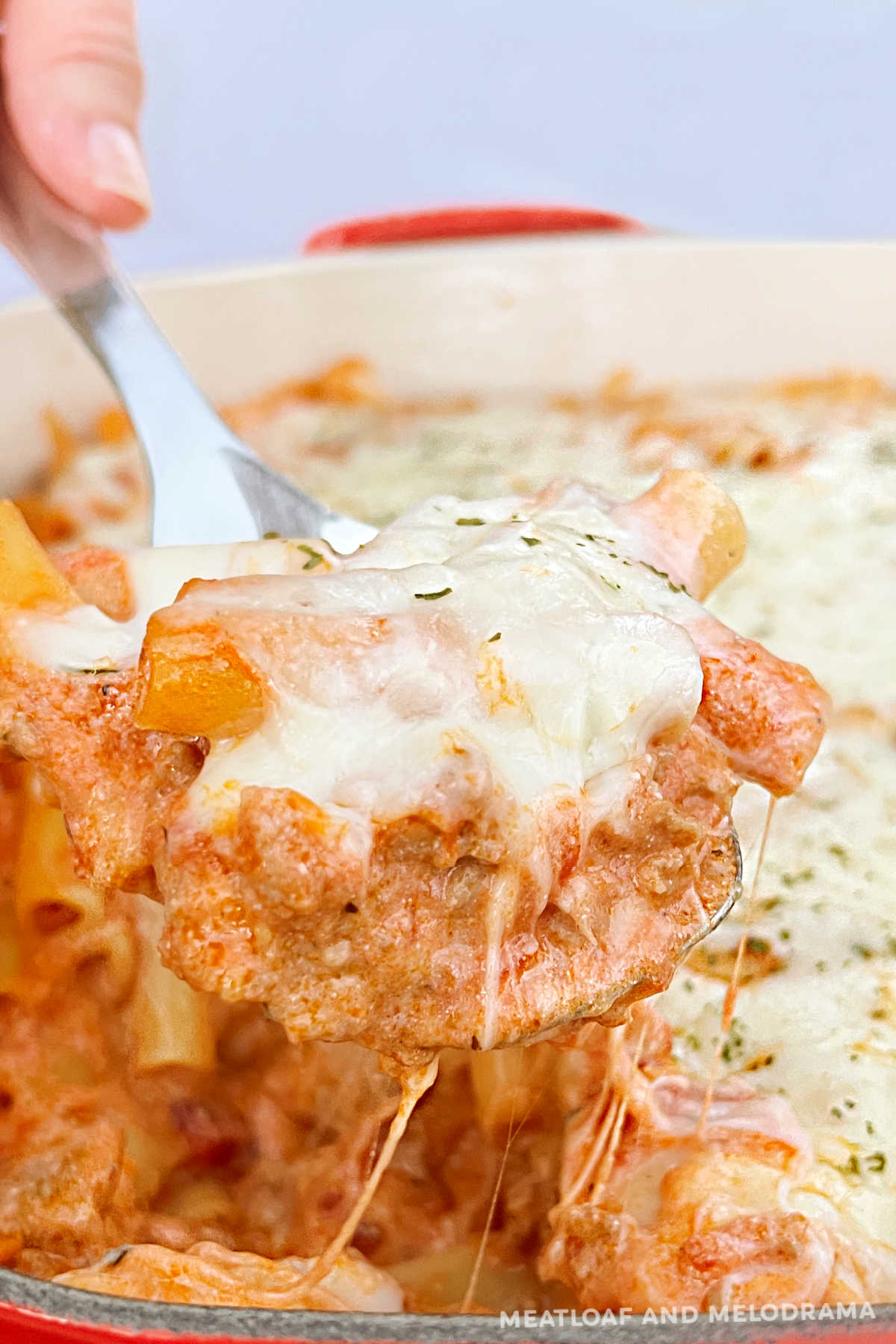 instant pot baked ziti with sausage and ricotta and mozzarella on serving spoon