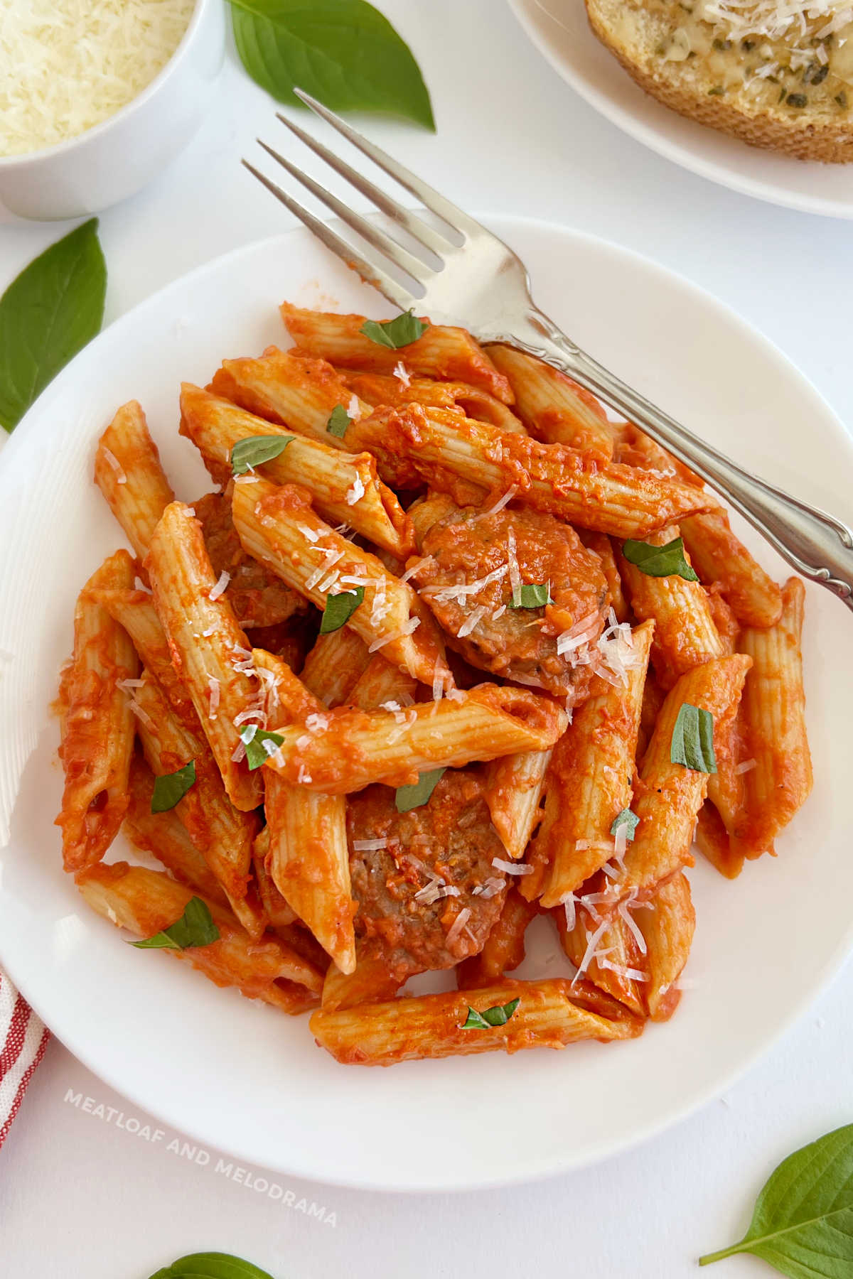 penne alla vodka with Italian sausage, Parmesan cheese and fresh basil