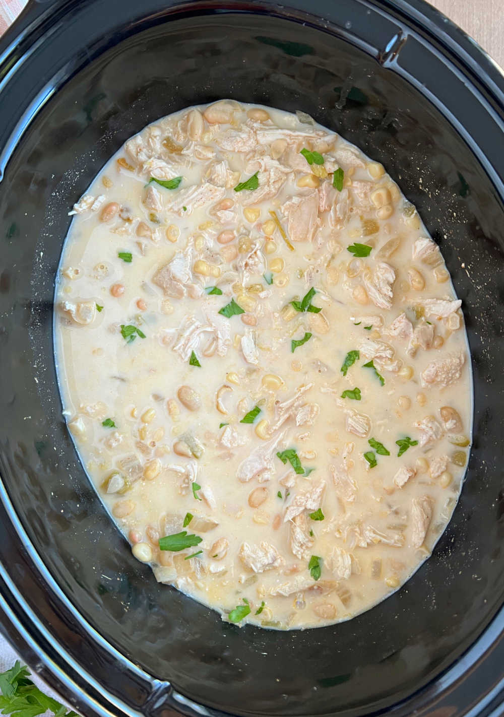 creamy crockpot white chicken chili in slow cooker