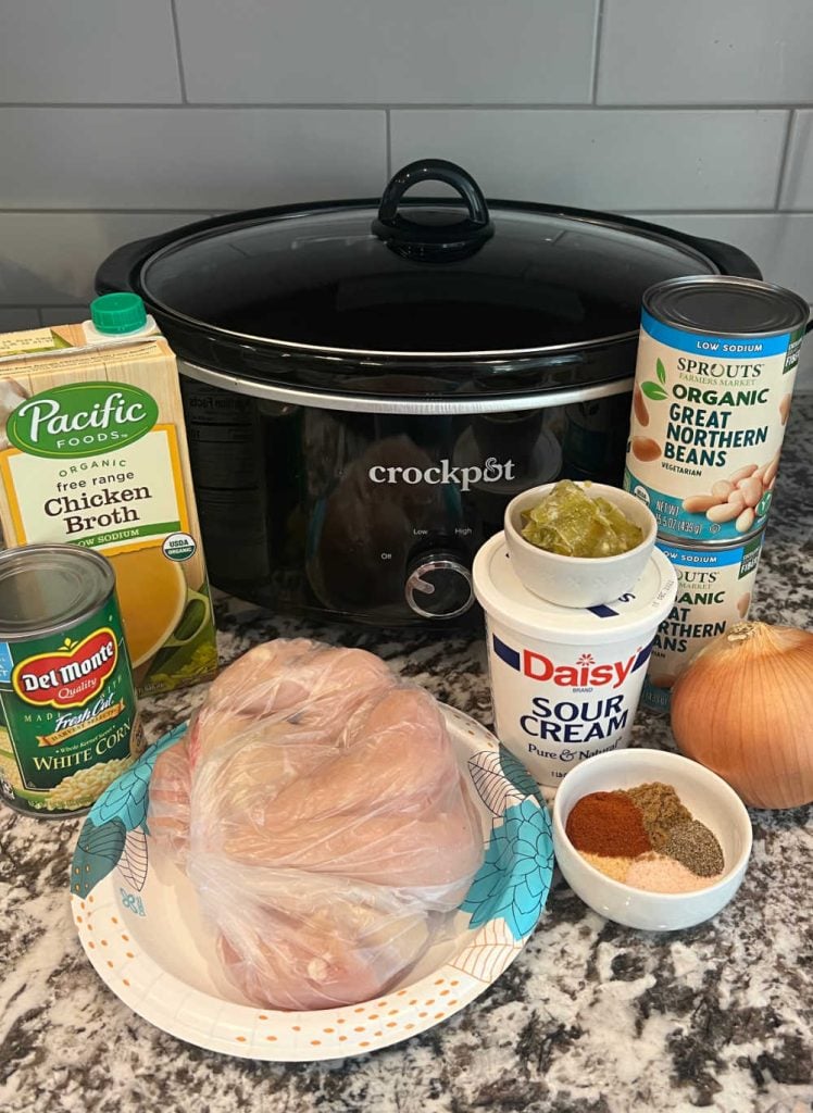chicken, broth, corn, great northern beans, sour cream and seasonings by a crock pot