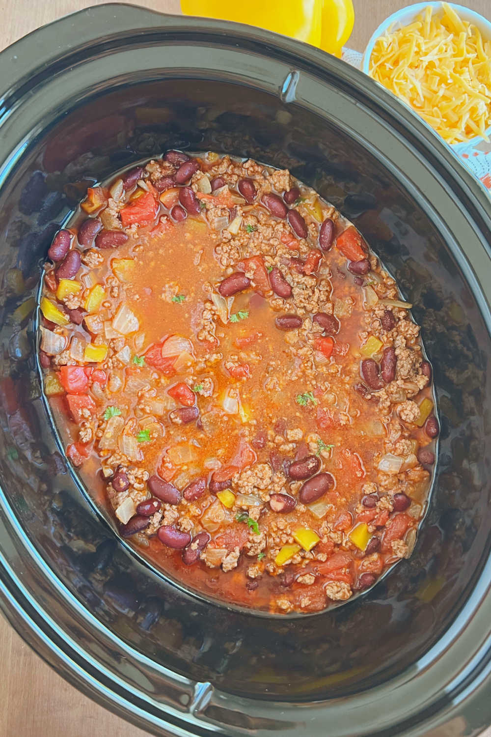 mild chili with ground beef in crockpot slow cooker