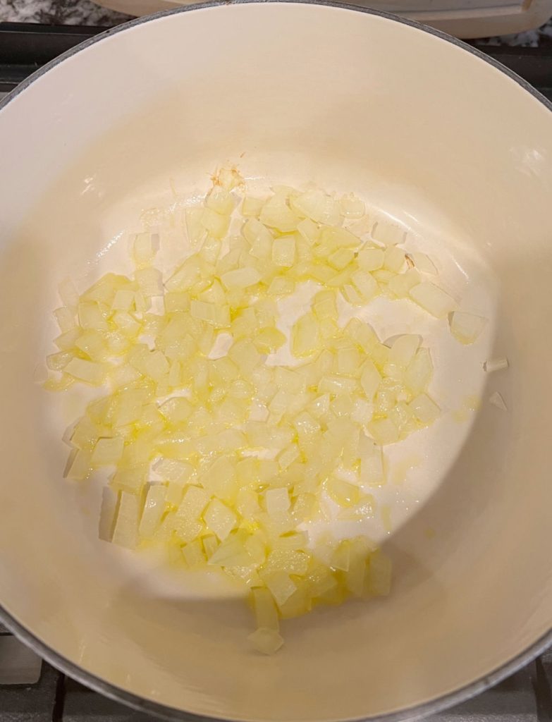 cook diced onions in olive oil in dutch oven