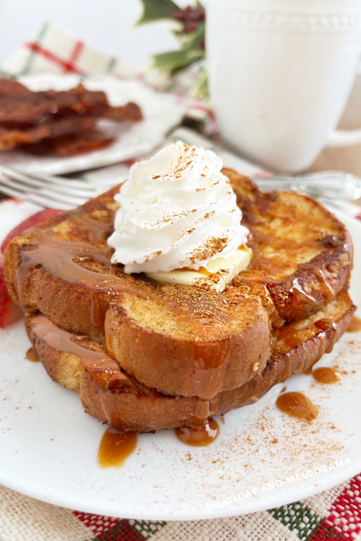 eggnog french toast with cinnamon and whipped cream on plate