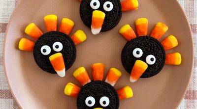 oreo turkey cookies with oreos and candy corn on a plate
