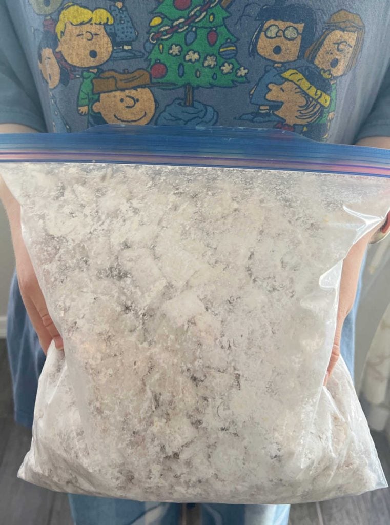 shake cereal with powdered sugar in freezer bag