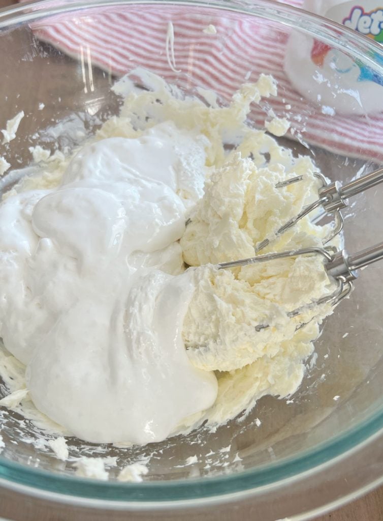 beat cream cheese and marshmallow fluff with hand mixer