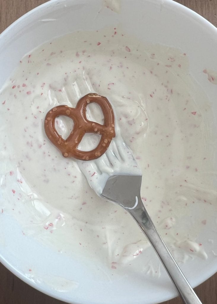 dip mini pretzel twists in white chocolate