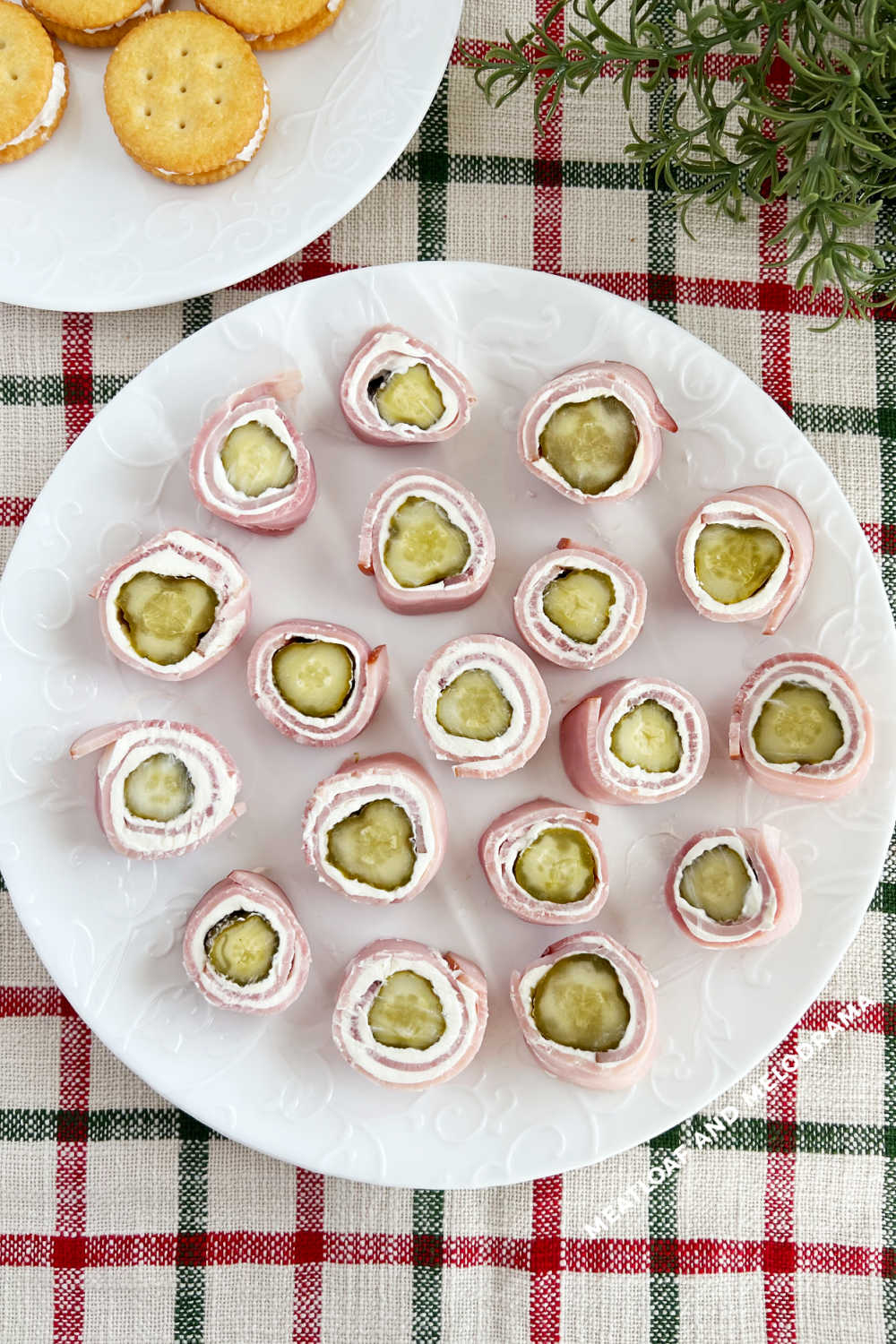 ham pickle roll ups on white plate on holiday table