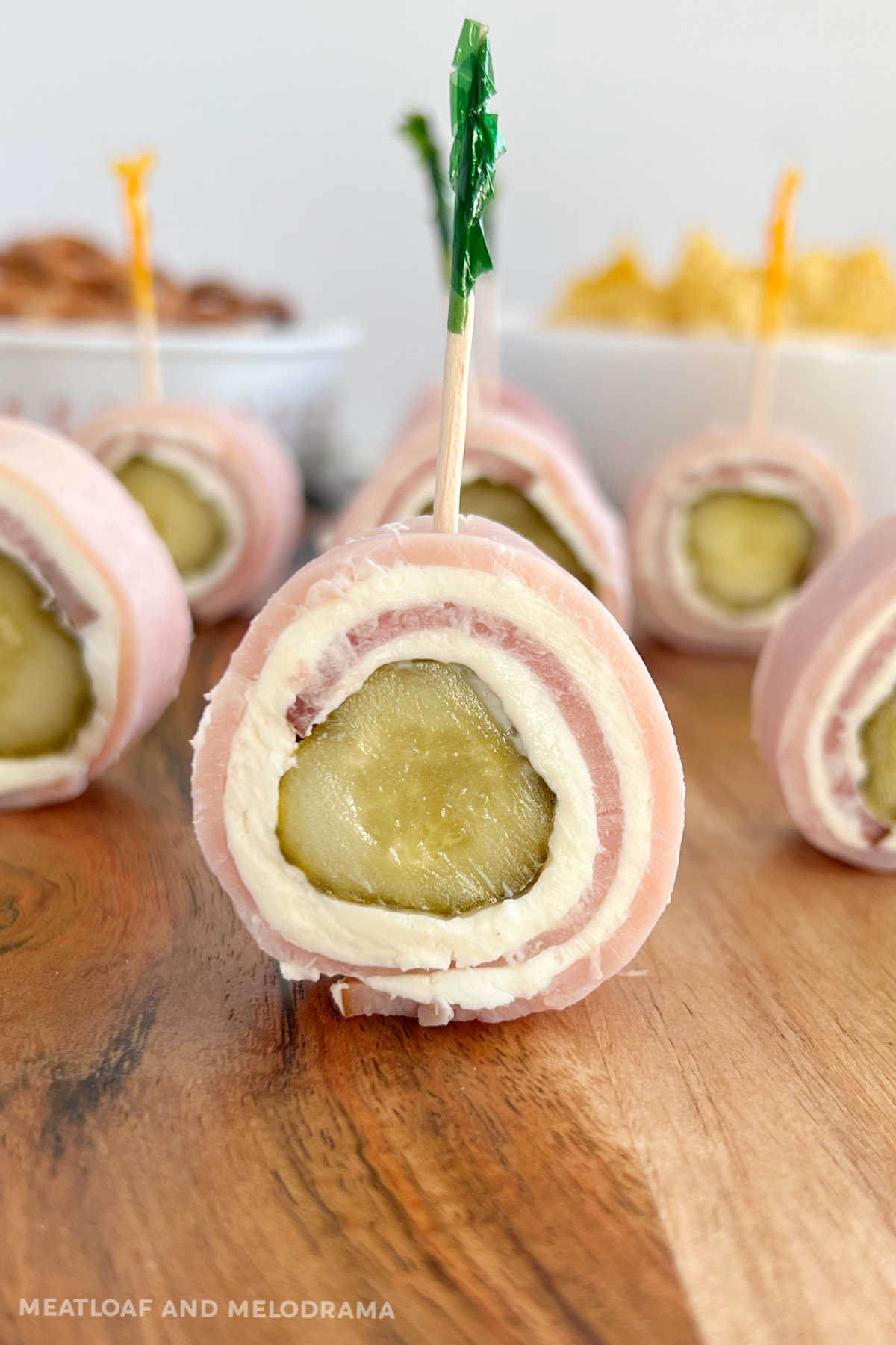 ham pickle roll ups with cream cheese (Polish sushi) on charcuterie board