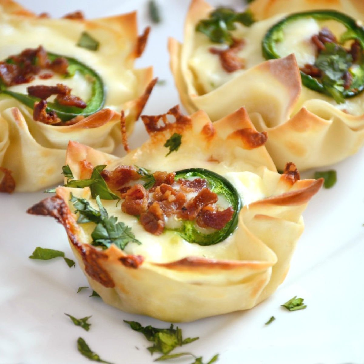 jalapeno popper wonton cups with bacon on a plate