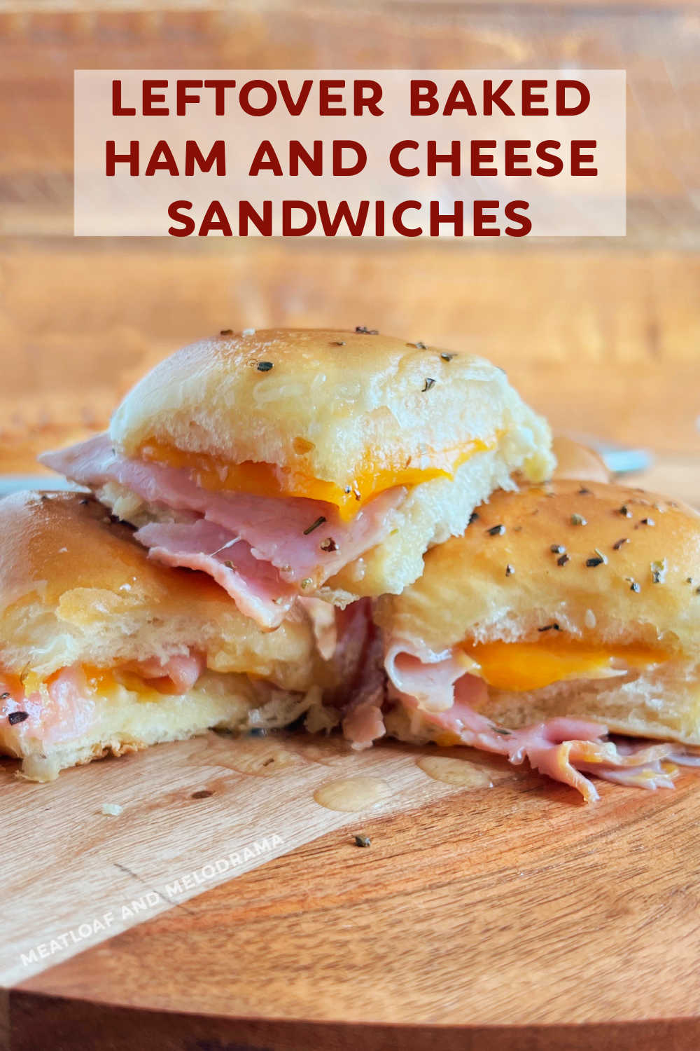 This leftover ham sandwich made with spiral ham slices and cheddar cheese baked in buttery soft rolls is an easy and delicious way to use up leftover holiday ham. Your whole family will love these hot ham and cheese sliders! via @meamel