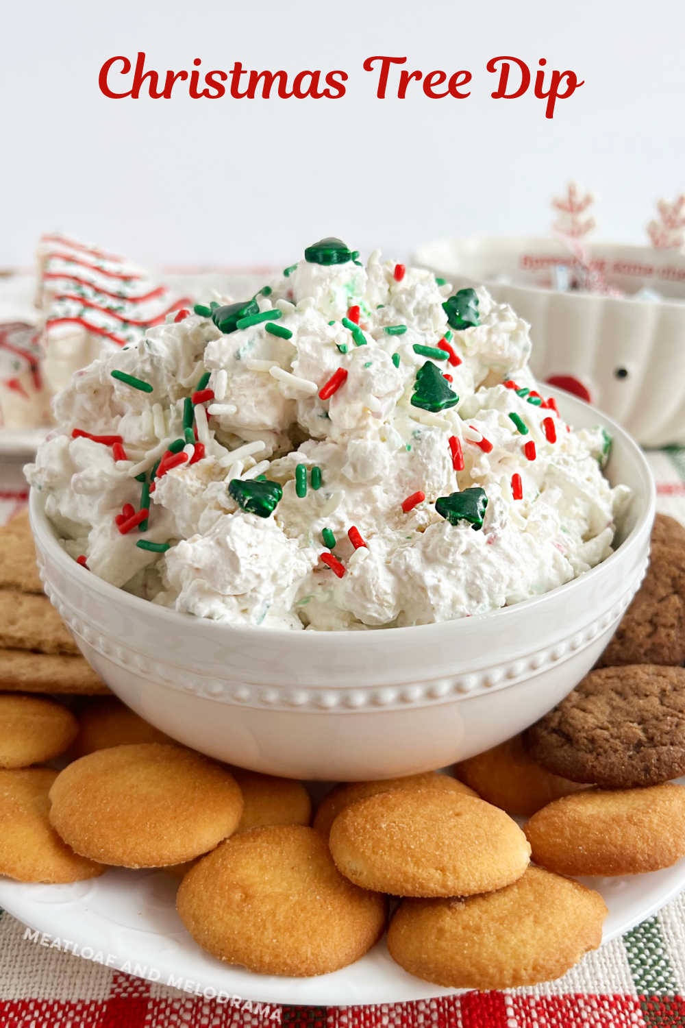 Little Debbie Christmas Tree Cake Dip is an easy recipe with seasonal snack cakes, cream cheese and Cool Whip. A festive no bake dessert recipe perfect for the holiday season! via @meamel