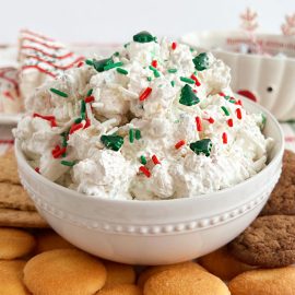 little Debbie Christmas tree cake dip with sprinkles and graham crackers on table