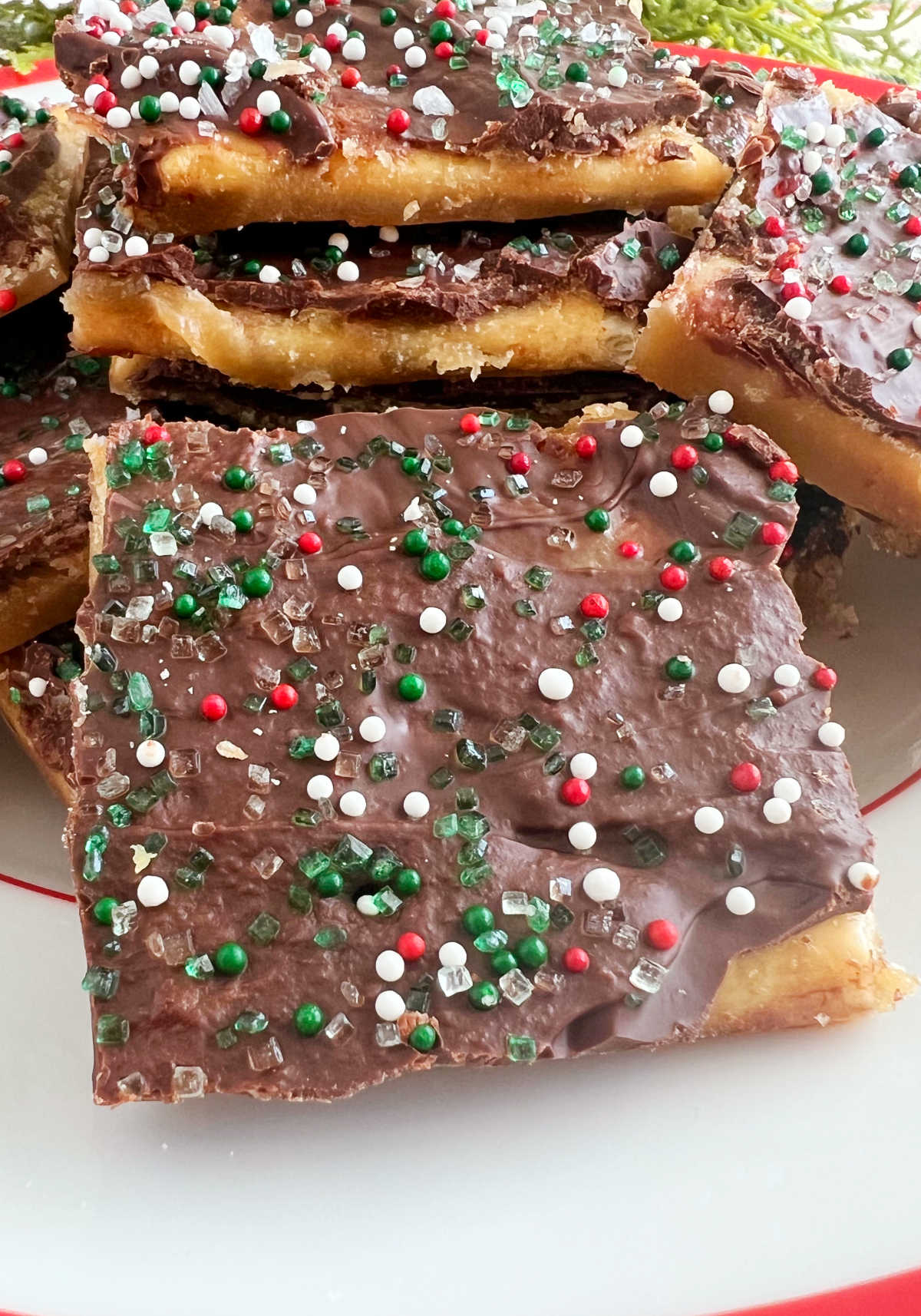 close up of saltine cracker toffee with holiday sprinkles