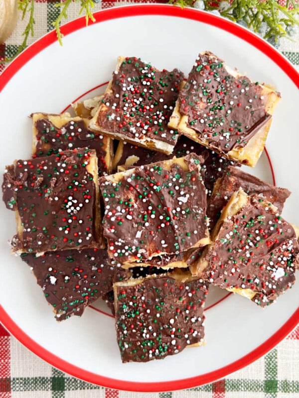 saltine toffee with melted chocolate and sprinkles on a plate