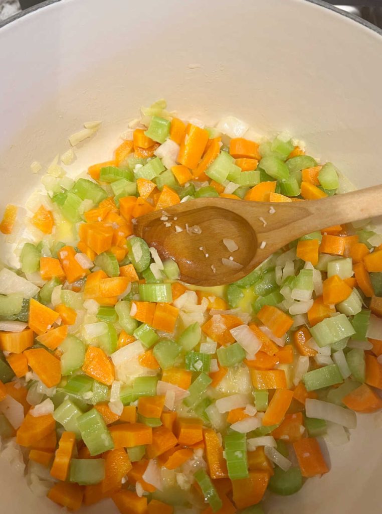 cook carrots, celery and onions in Dutch oven