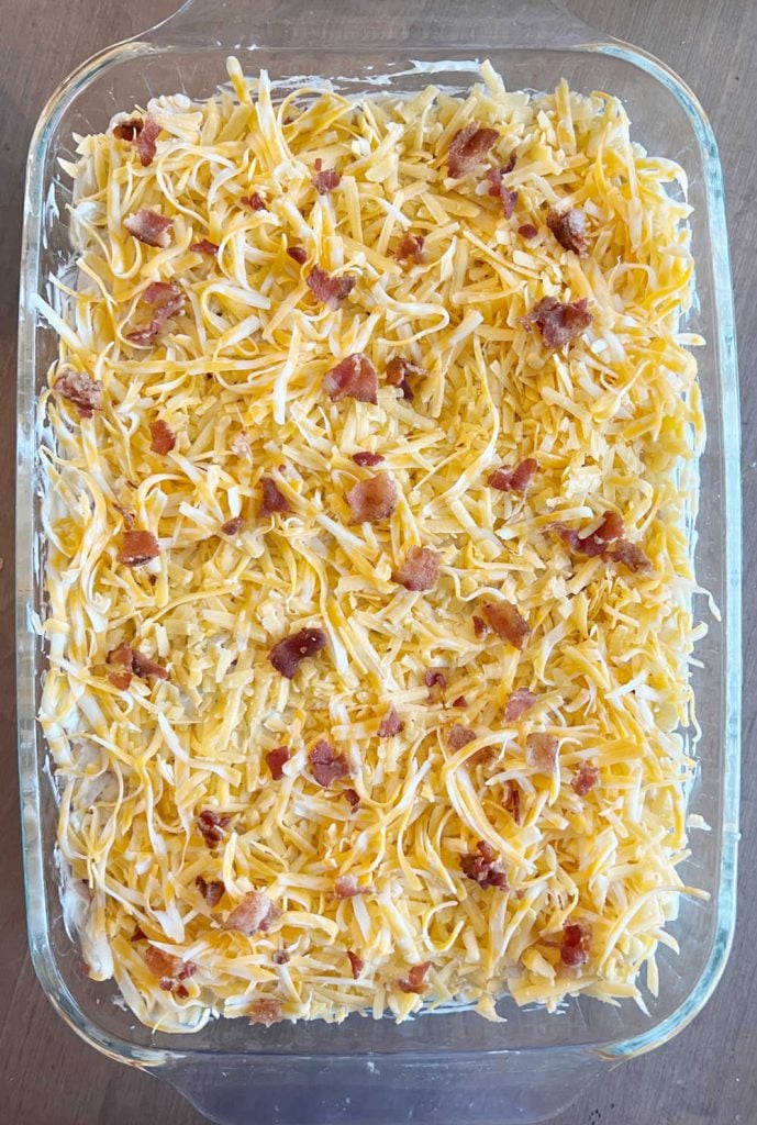 crack chicken casserole with bacon and cheddar cheese in baking dish