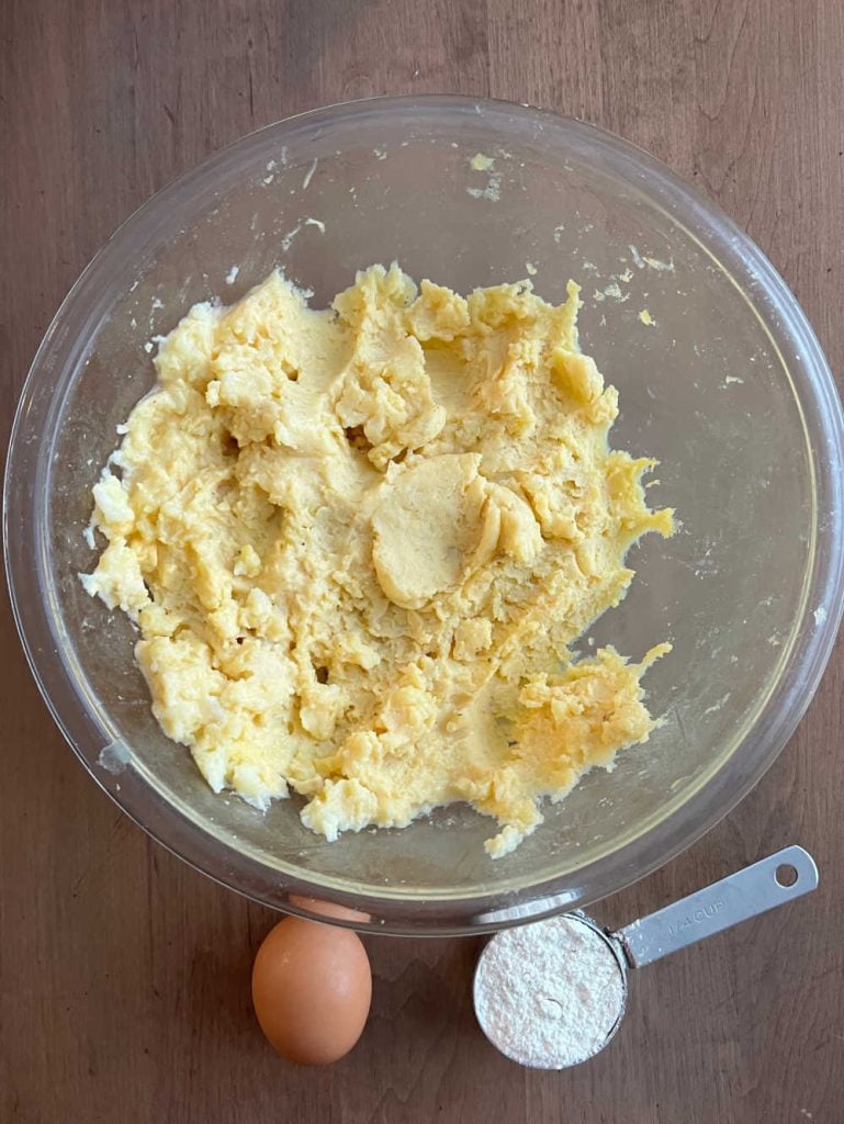 bowl of leftover mashed potatoes, egg and flour