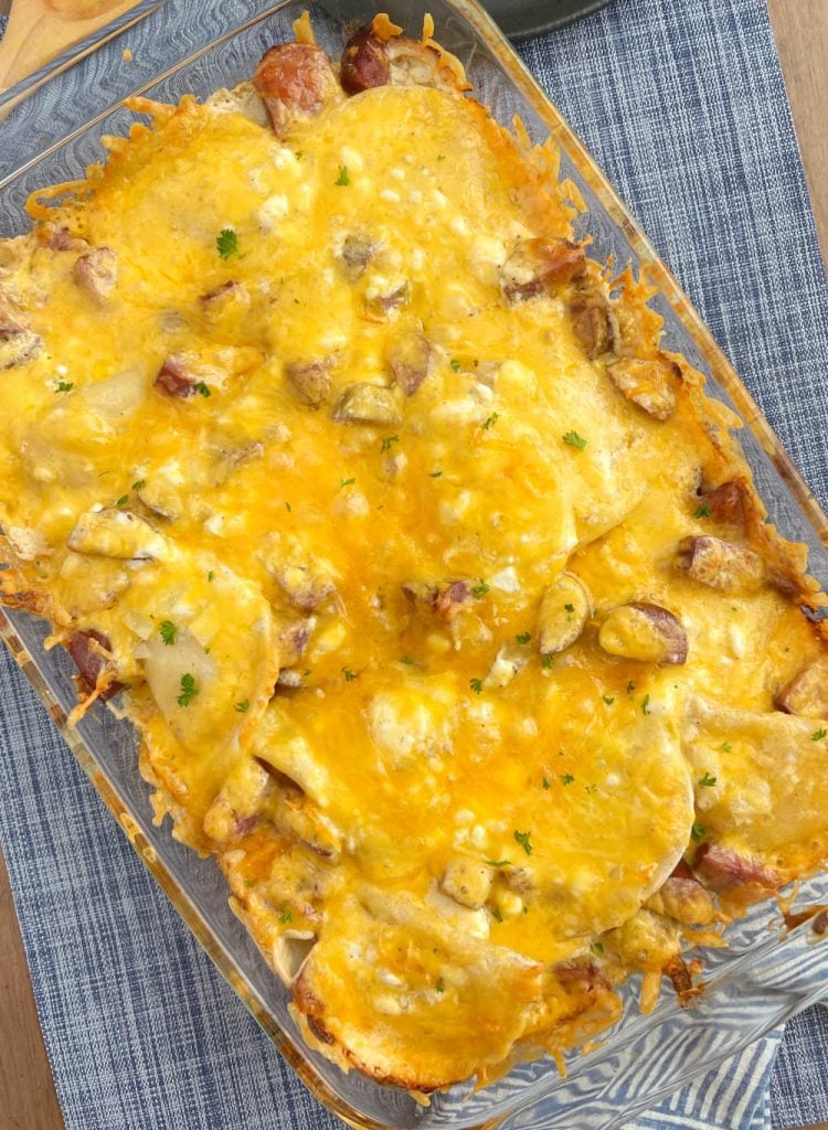 baked pierogi casserole with cheddar cheese in baking dish