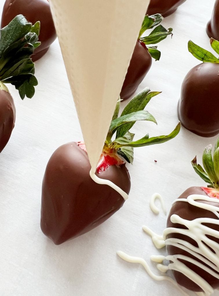 drizzle white chocolate over chocolate covered strawberries