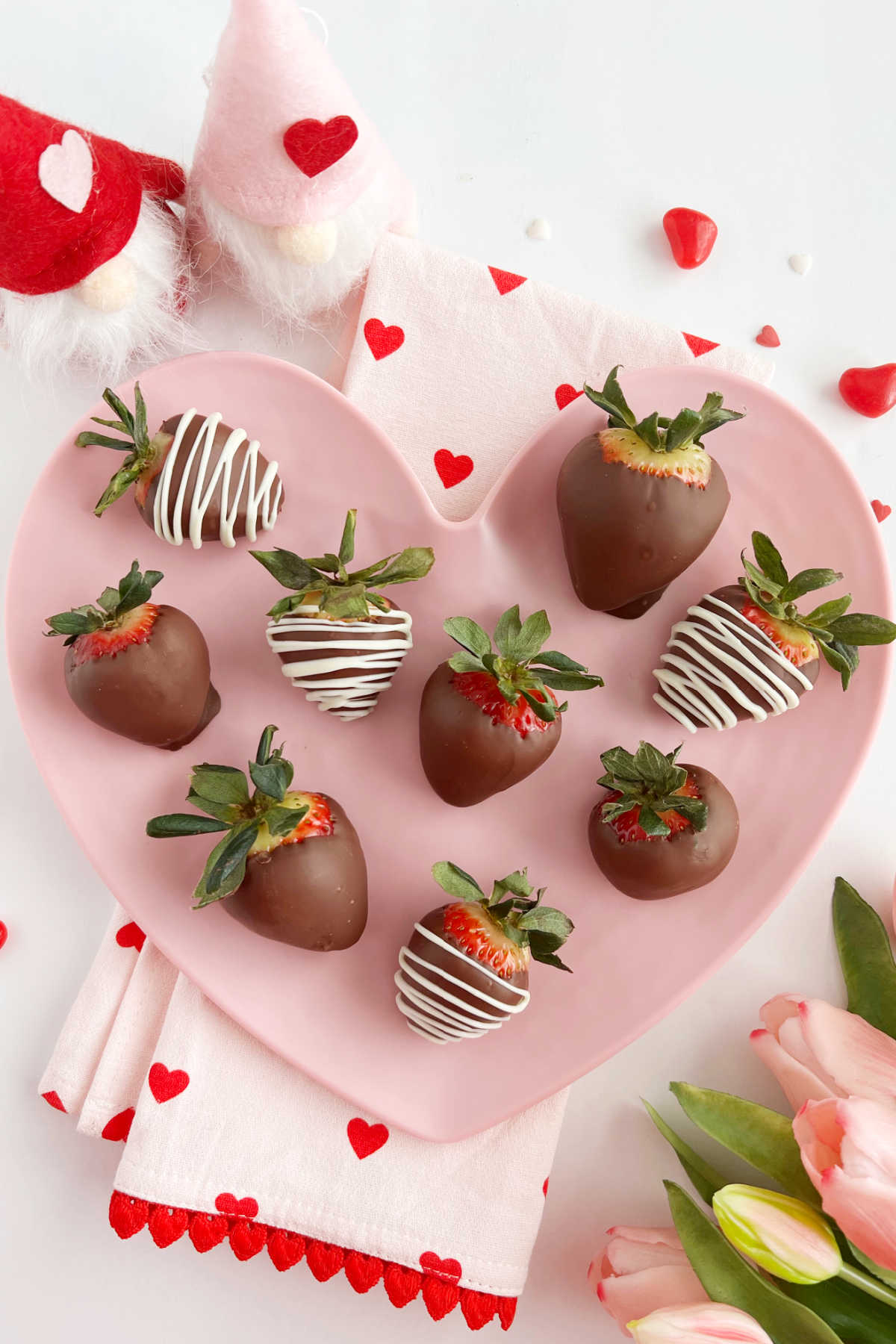 chocolate covered strawberries for Valentine's Day or mothere's day on pink heart plate