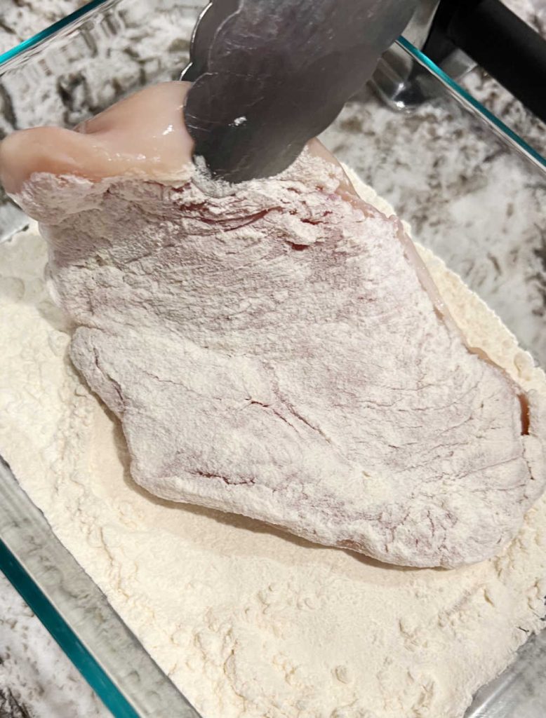dredge chicken cutlet in flour