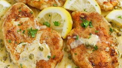 lemon chicken piccata in creamy lemon butter sauce with white wine and capers