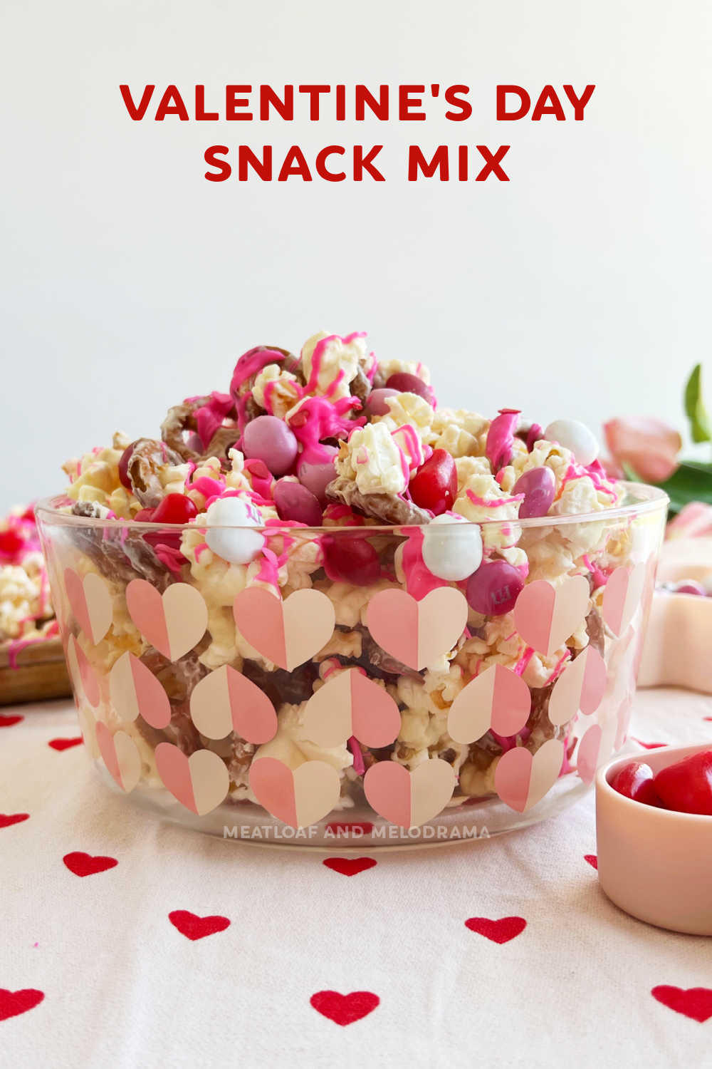 Valentine's Day Snack Mix is an easy recipe made with popcorn, pretzels, Valentine candy and white chocolate. A salty and sweet treat everyone will love! via @meamel