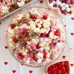 Valentine Day snack mix with popcorn and Valentine's Day candy on the table