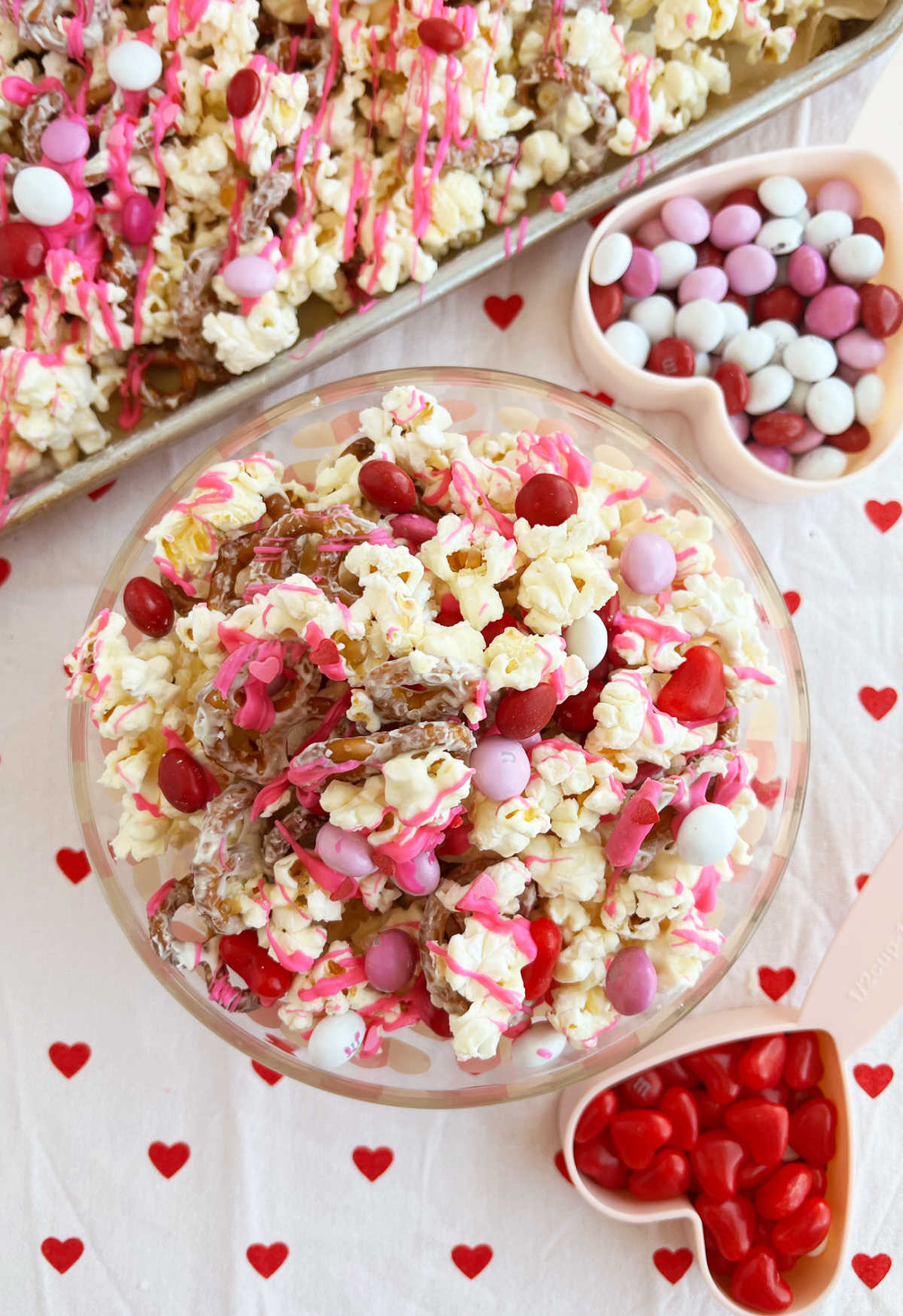 Valentine Day snack mix with popcorn and candy on the table
